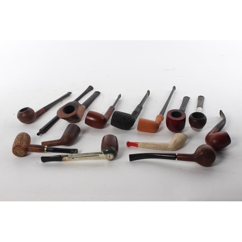 464 - A collection of various vintage and antique pipes.