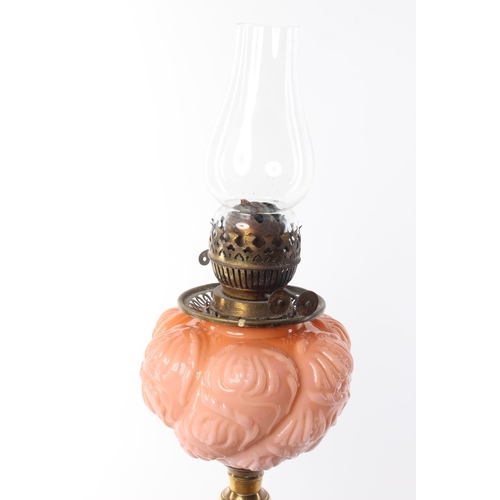 478 - A stunning antique oil lamp with decorative coloured glass bowl.