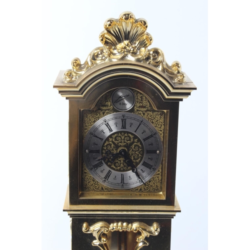 484 - A brass clock, modelled as a grandfather clock.