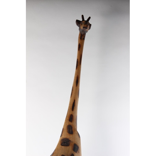 498 - A large wooden giraffe. Approx 115cm.