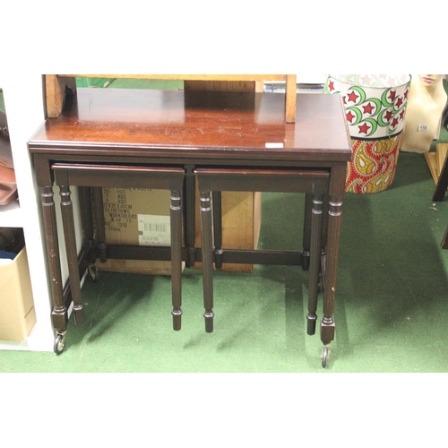 499 - A vintage nest of tables.