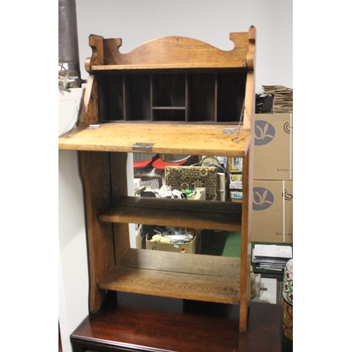 506 - An antique Oak Arts & Crafts bookcase bureau. Approx 106x62x21cm.