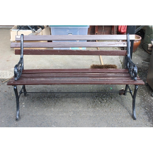 508 - A garden bench with cast iron ends.