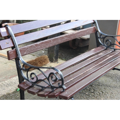 508 - A garden bench with cast iron ends.