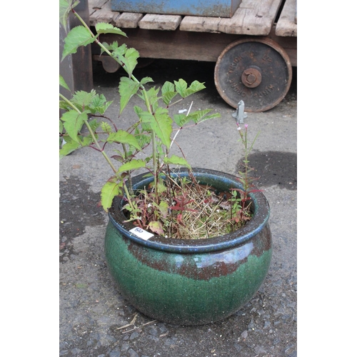 510 - A large ceramic planter with green glaze.