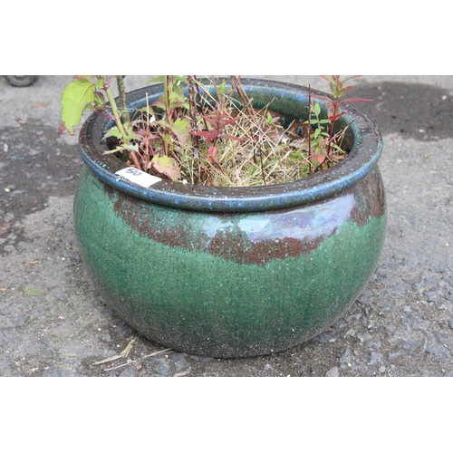 510 - A large ceramic planter with green glaze.