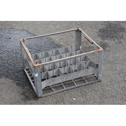 514 - A vintage metal bottle crate.