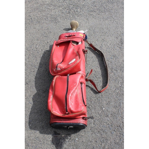 520 - A golf bag with contents.