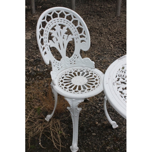 565 - A cast metal garden set, to include table & pair of chairs.