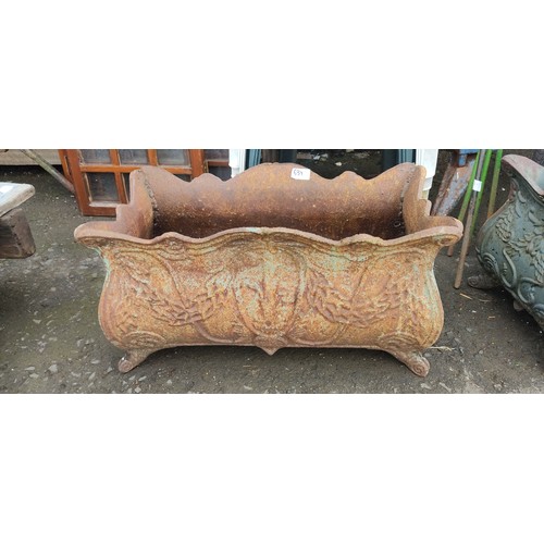 534 - A large antique cast iron garden planter.