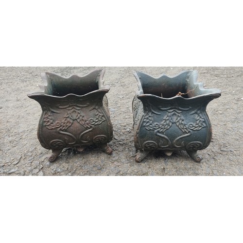 534B - A small pair of antique cast metal planters.