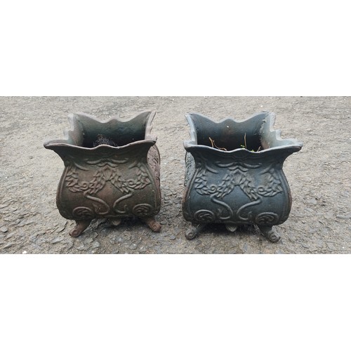 534B - A small pair of antique cast metal planters.