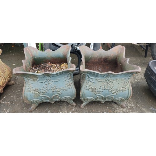 534C - A pair of antique cast iron planters.