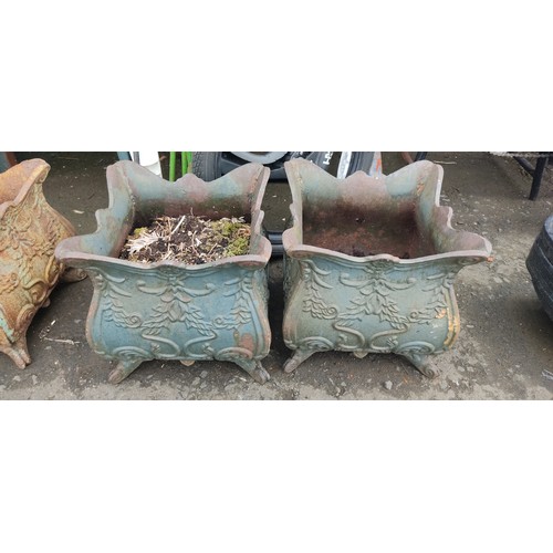 534C - A pair of antique cast iron planters.