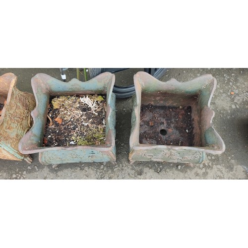 534C - A pair of antique cast iron planters.