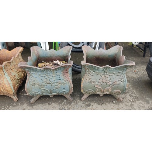 534C - A pair of antique cast iron planters.