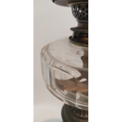 339 - An antique oil lamp with clear glass bowl.