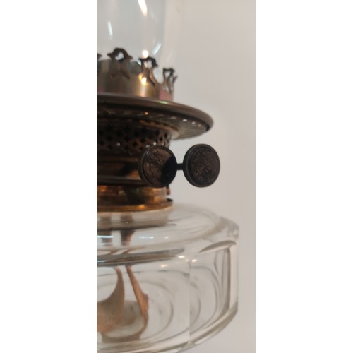 339 - An antique oil lamp with clear glass bowl.