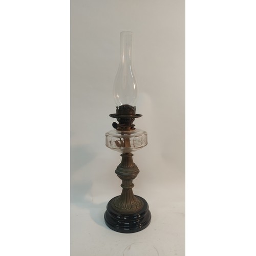 339 - An antique oil lamp with clear glass bowl.