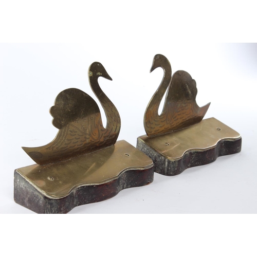 29 - A pair of brass bookends modelled as swans.