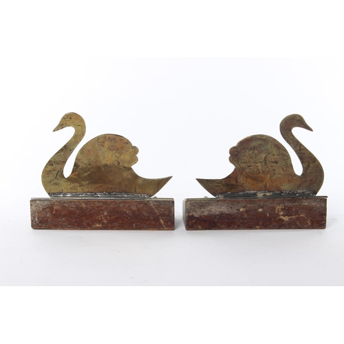 29 - A pair of brass bookends modelled as swans.