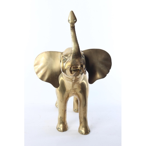 50 - A large brass model of an elephant. Approx  33x33cm.