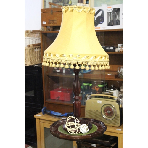 227 - A wine table with green leather top and table lamp.