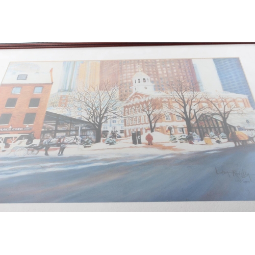 493 - A framed limited edition print of a street scene, signed by the Artist Linda Ravella.