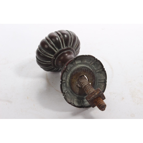 25 - An antique copper door knob.