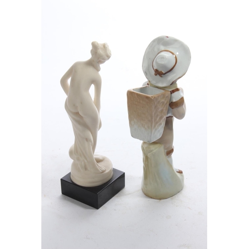 27 - An antique bisque figure & another.