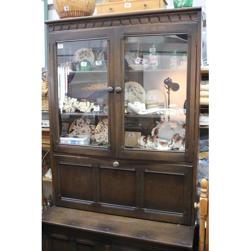 34 - An Ercol bureau bookcase. Measuring 196x98x50cm.