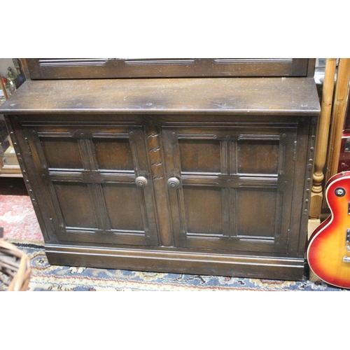 34 - An Ercol bureau bookcase. Measuring 196x98x50cm.