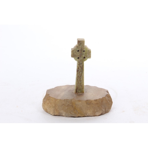 61 - A vintage Connemara marble Celtic cross mounted on onyx base.