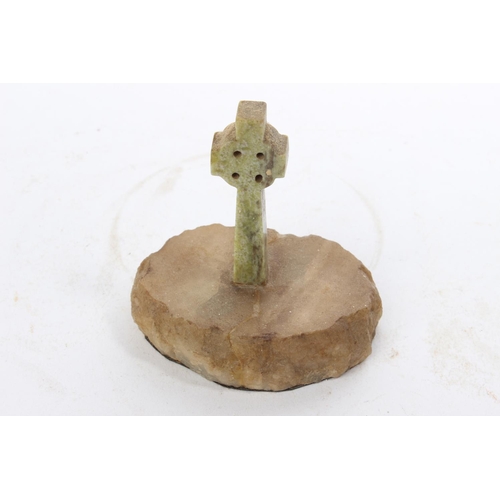 61 - A vintage Connemara marble Celtic cross mounted on onyx base.