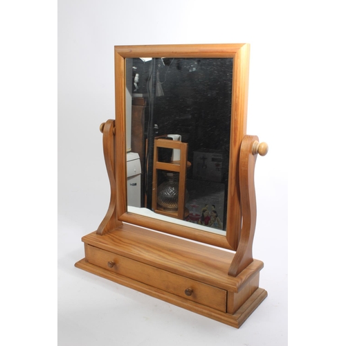 63 - A pine dressing table mirror with drawer.