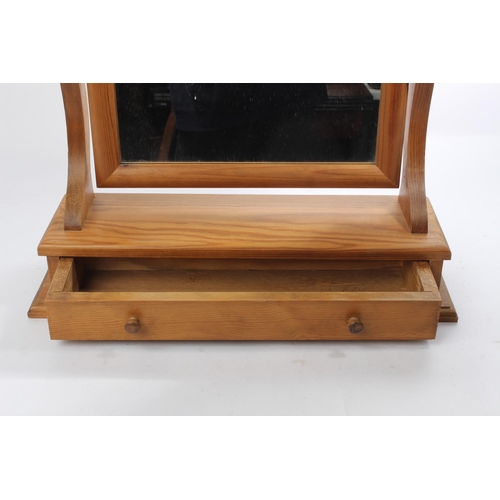 63 - A pine dressing table mirror with drawer.