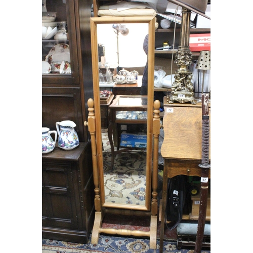 65 - A pine framed Cheval Mirror.