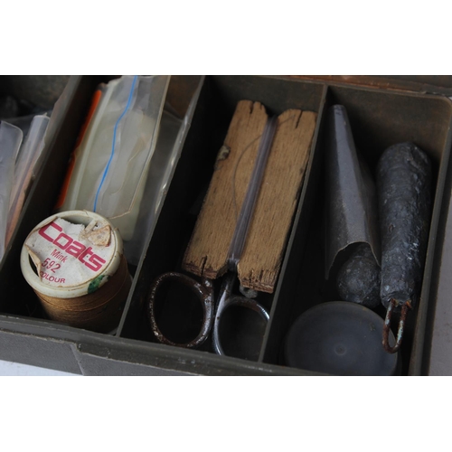 7 - A fishing tackle box with contents.