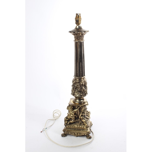 73 - An antique/ vintage brass table lamp base with Cherub decoration, measuring 62cm tall.