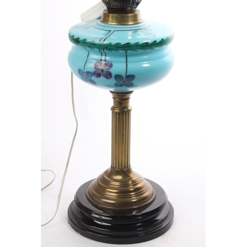 76 - An antique oil lamp with painted glass font & etched shade, which has been converted to electric. Me... 