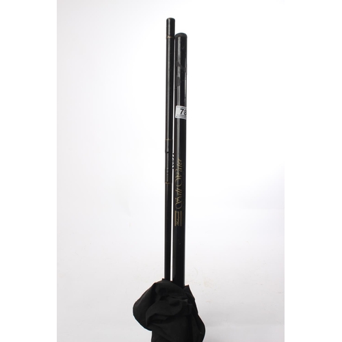 78 - A cased 2 piece fishing rod.