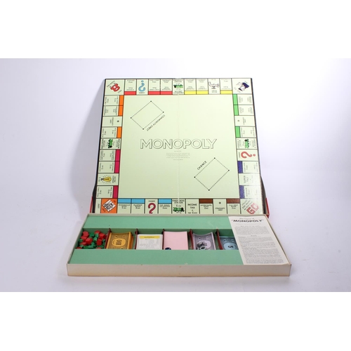 79 - A vintage Monopoly board game & wooden tray.