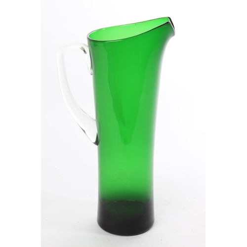 104 - A tall retro green glass jug.