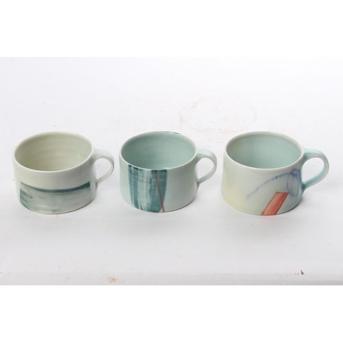 511 - A set of 3 studio pottery coffee cups by local ceramicist Adam Frew.