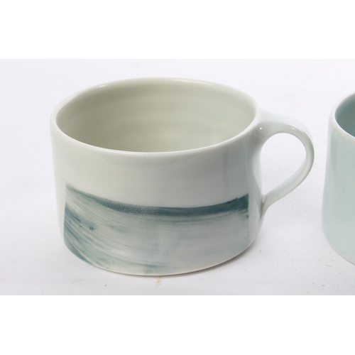 511 - A set of 3 studio pottery coffee cups by local ceramicist Adam Frew.