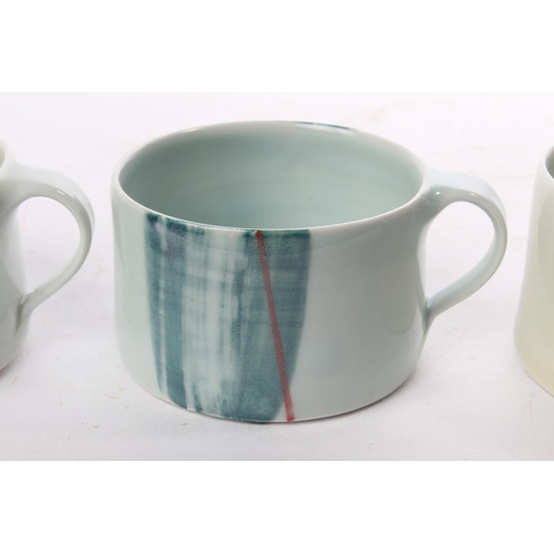 511 - A set of 3 studio pottery coffee cups by local ceramicist Adam Frew.