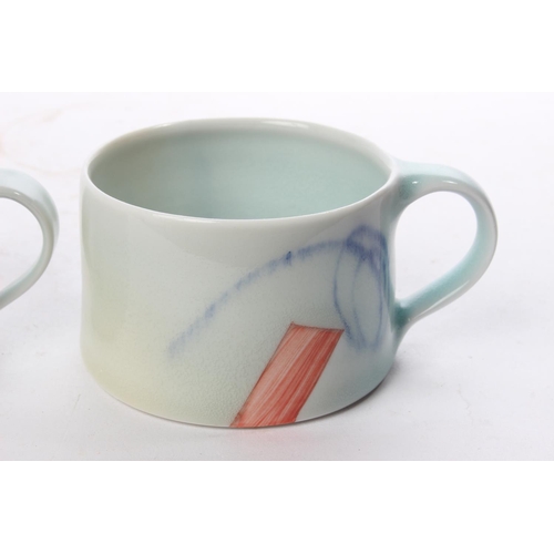 511 - A set of 3 studio pottery coffee cups by local ceramicist Adam Frew.