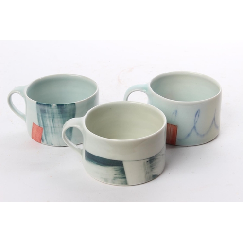 511 - A set of 3 studio pottery coffee cups by local ceramicist Adam Frew.