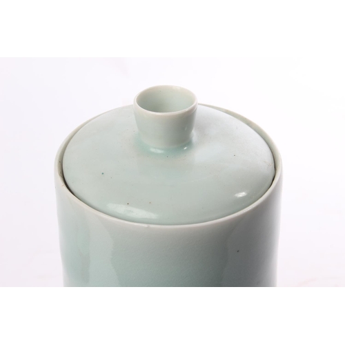 513 - A studio pottery lidded pot by local ceramicist Adam Frew, measuring 28cm tall, including lid.