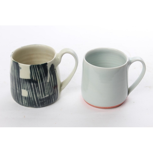 514 - A set of 2 studio pottery mugs by local ceramicist Adam Frew.